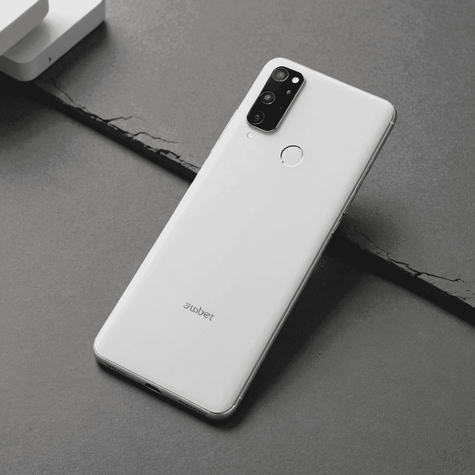 A slim, white smartphone with dual rear cameras and a fingerprint sensor, displayed at an angle to show its thin profile.